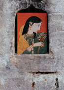 Miniature painting of a woman with jewelry and flowers in a stone niche.